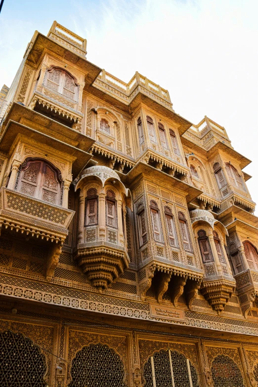 an intricate building with many windows and balconies