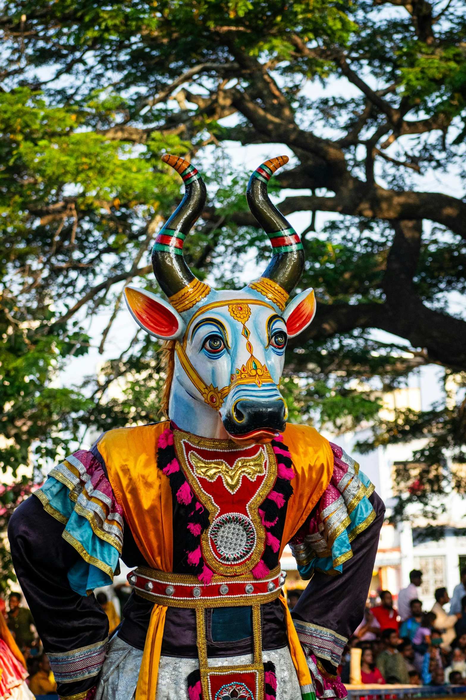 the parade is celeting and there are some big bull dancers on the street