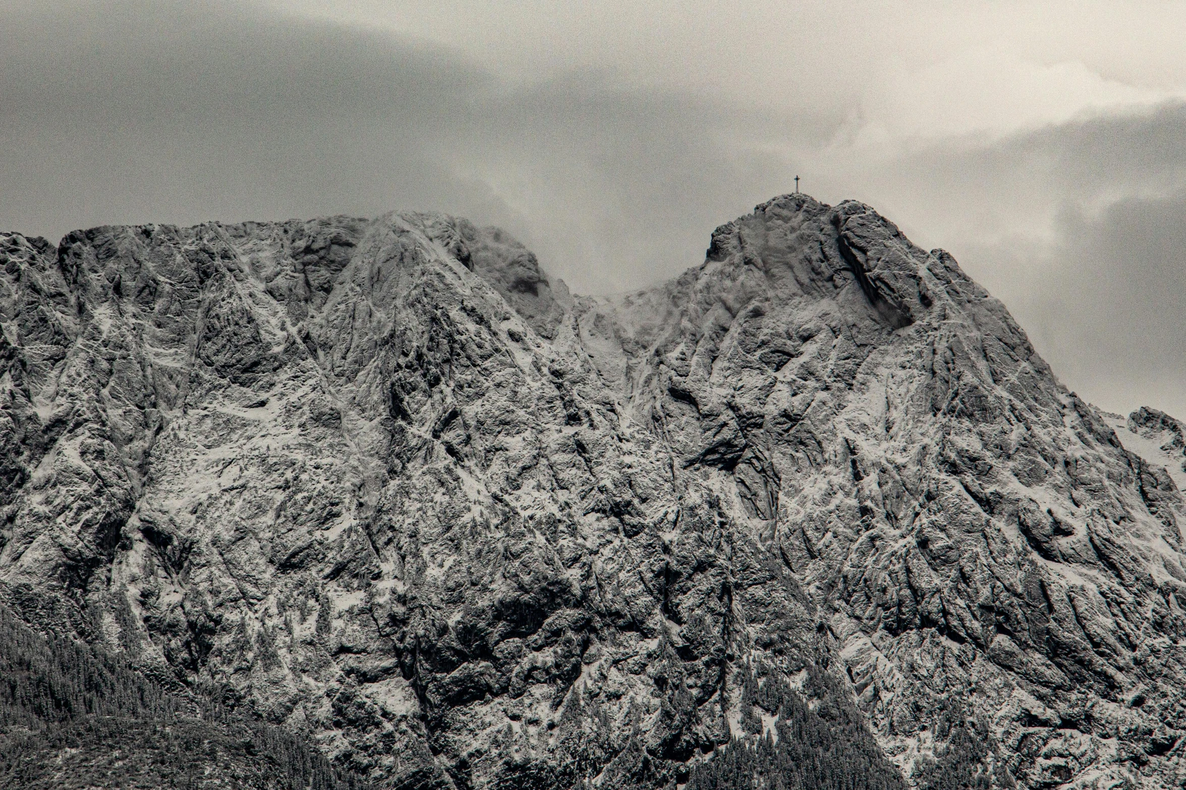 black and white pograph of mountains in the clouds