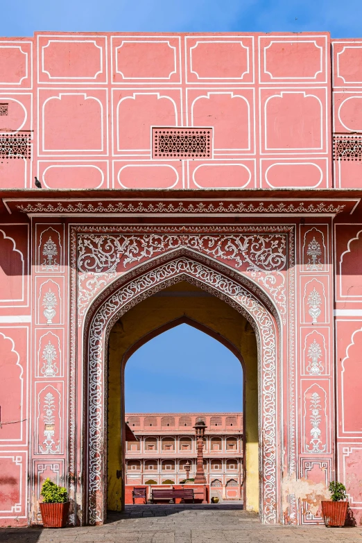 the gate to a building has carvings on it