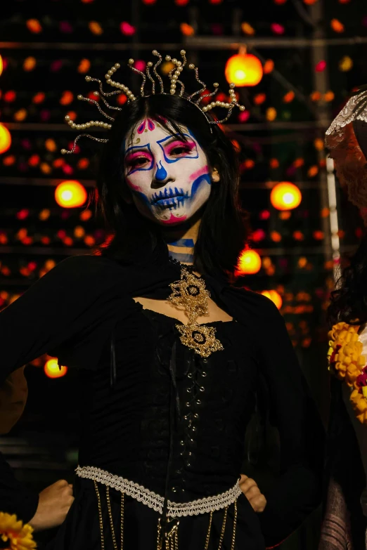 two women wearing face painted white and red