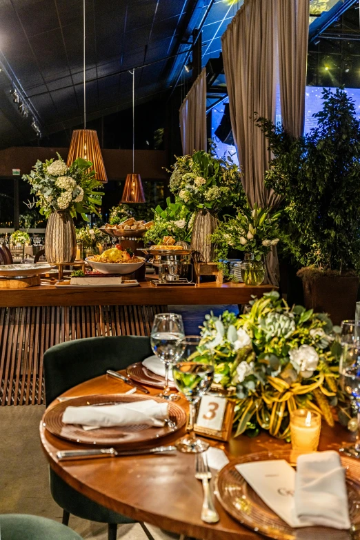 the tables and chairs are covered with candles and flowers