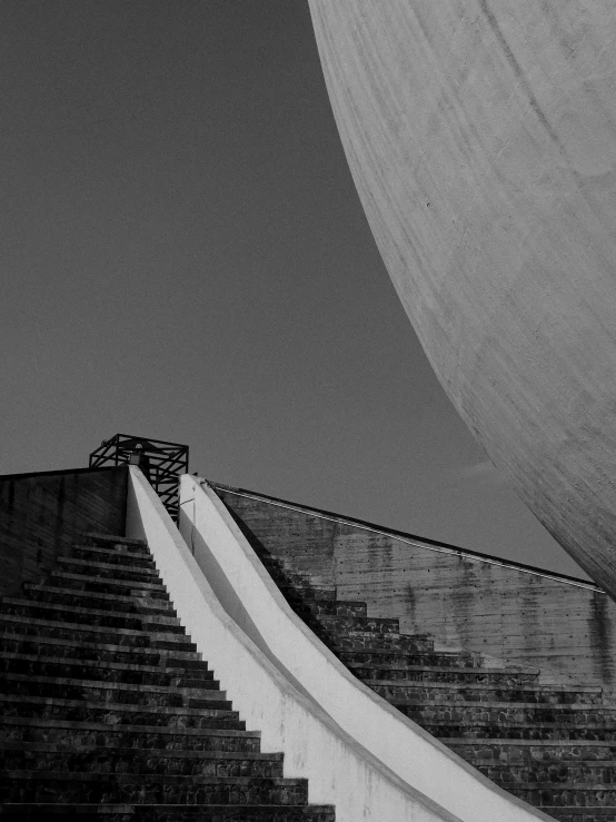 some black and white stairs a umbrella and a building