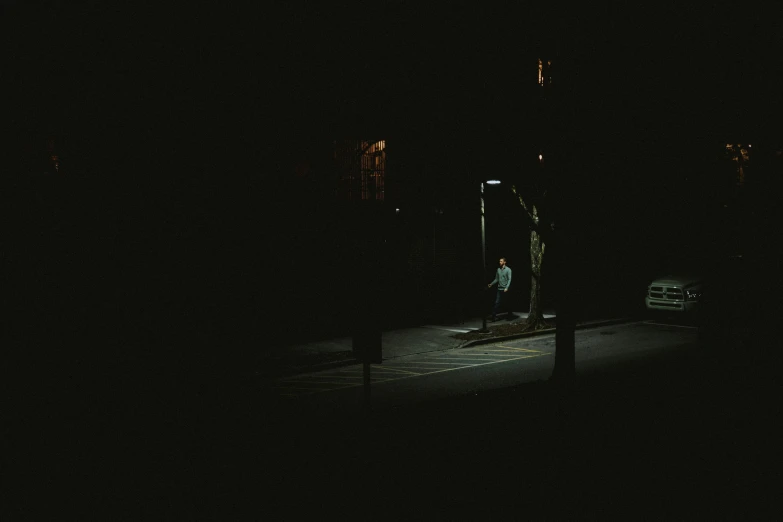 a couple of people standing by a parking meter