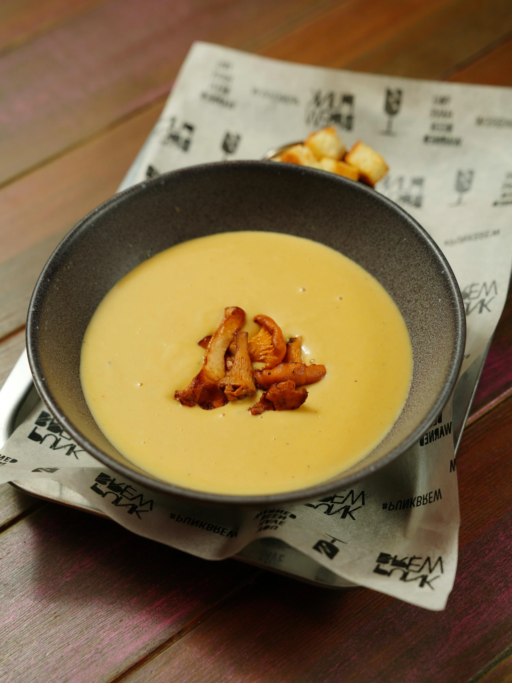 a bowl of soup is sitting on the table