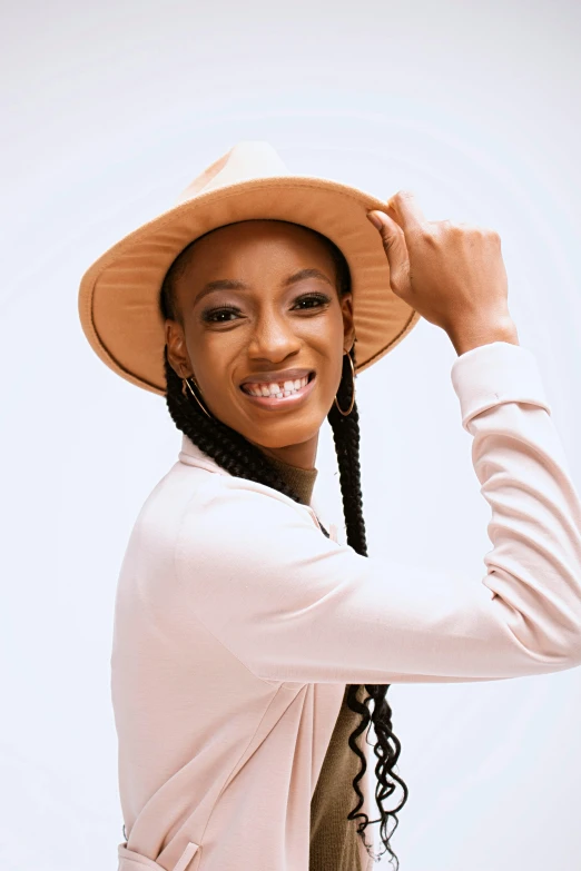 a woman wearing a hat posing for a po