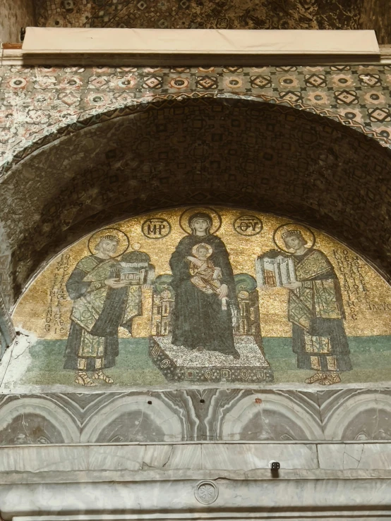 ornate mosaics and carvings adorn the entrance to a stone building