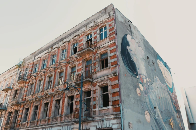 an abandoned building that has been vandalized with street art