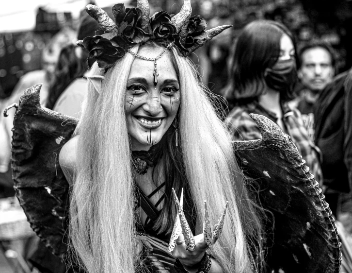 woman in costume with long hair in crowd