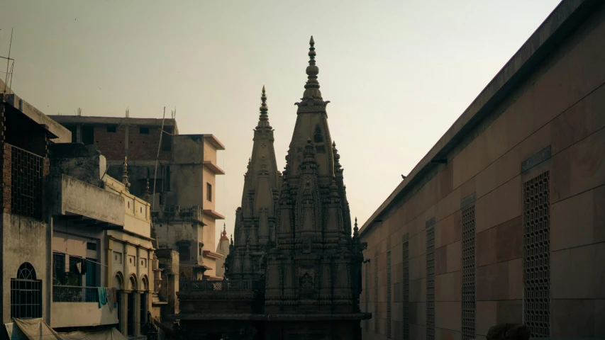 two cathedrals and one clock tower in a city street