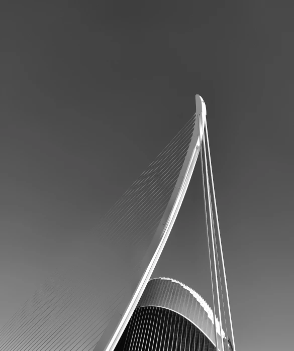 a very tall building sitting under a cloudy sky