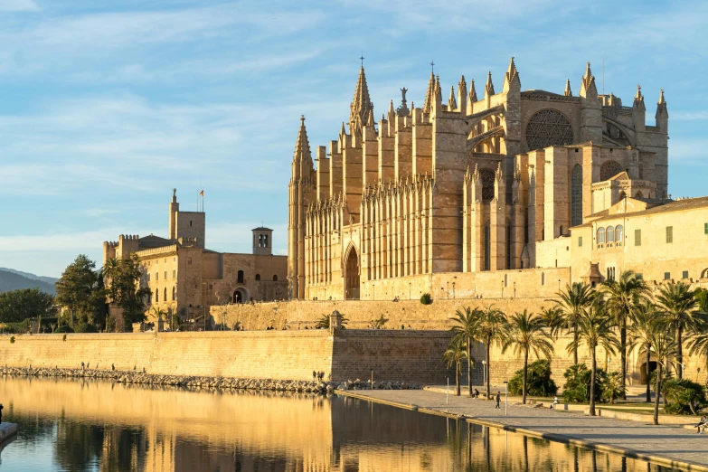 an old cathedral standing next to the waterside