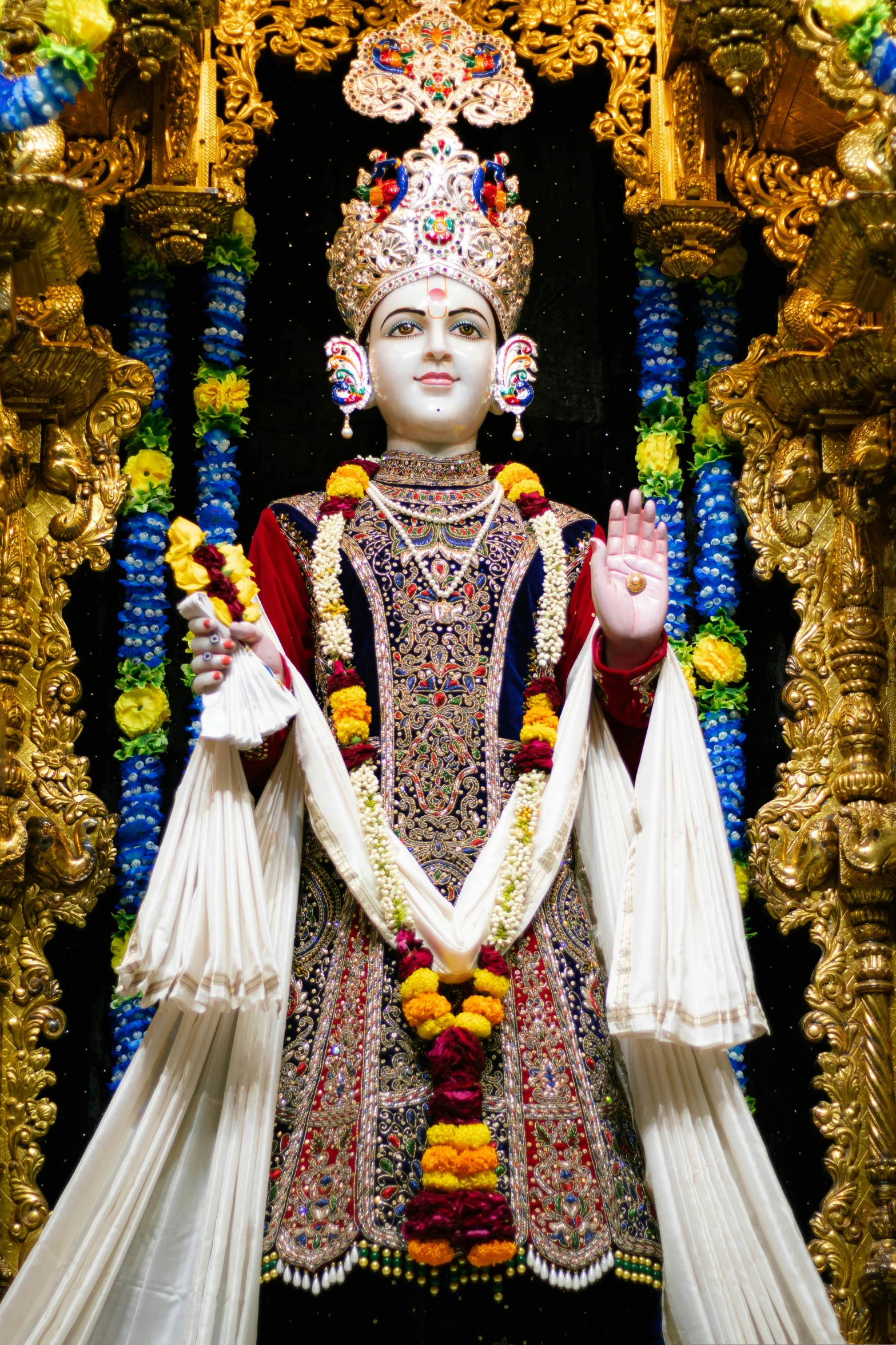 a statue of goddess srishtra in a temple