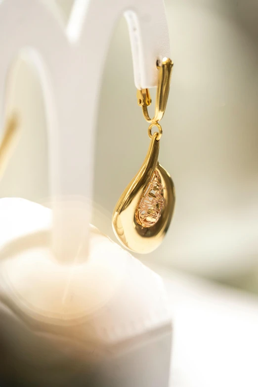 close up picture of a single earrings displayed