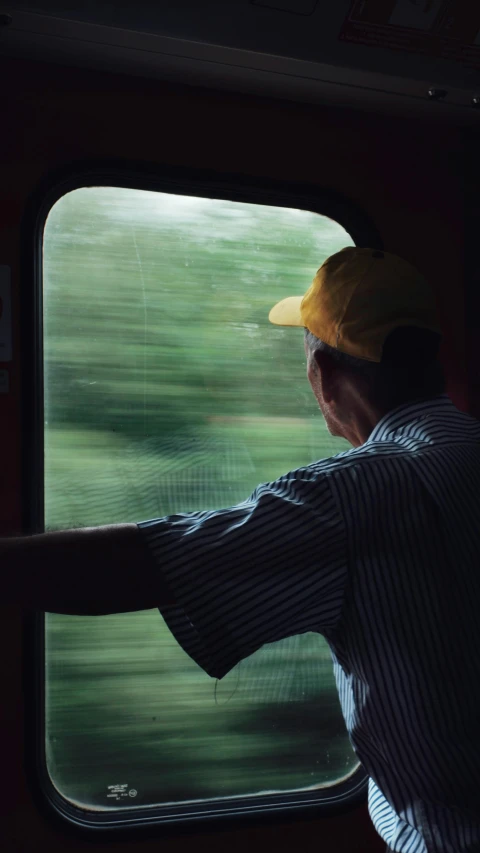 the view from a train window that shows trees outside