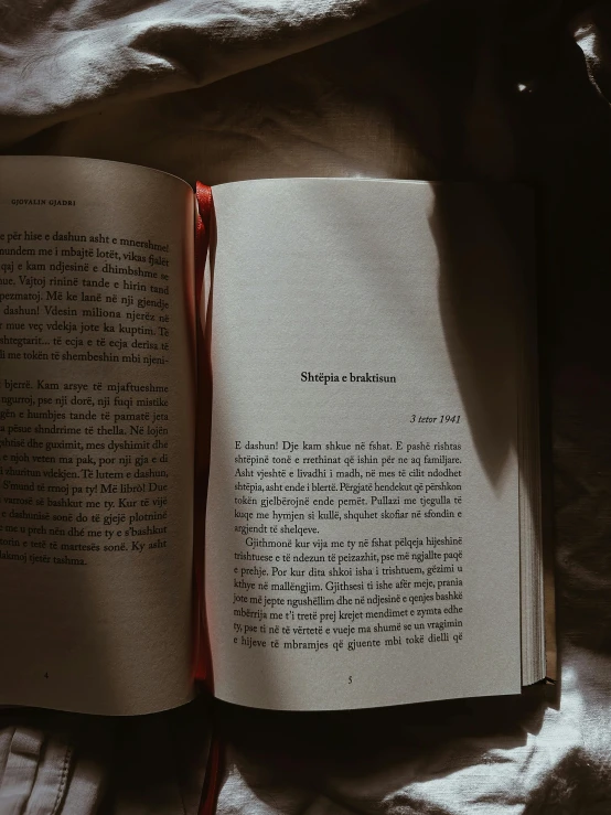 a book opened to a story with the pages lined down