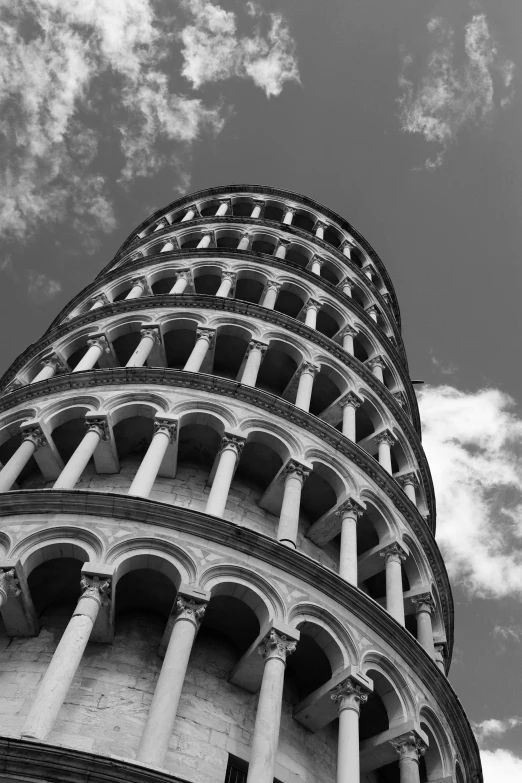 a very tall tower sitting under a cloudy sky