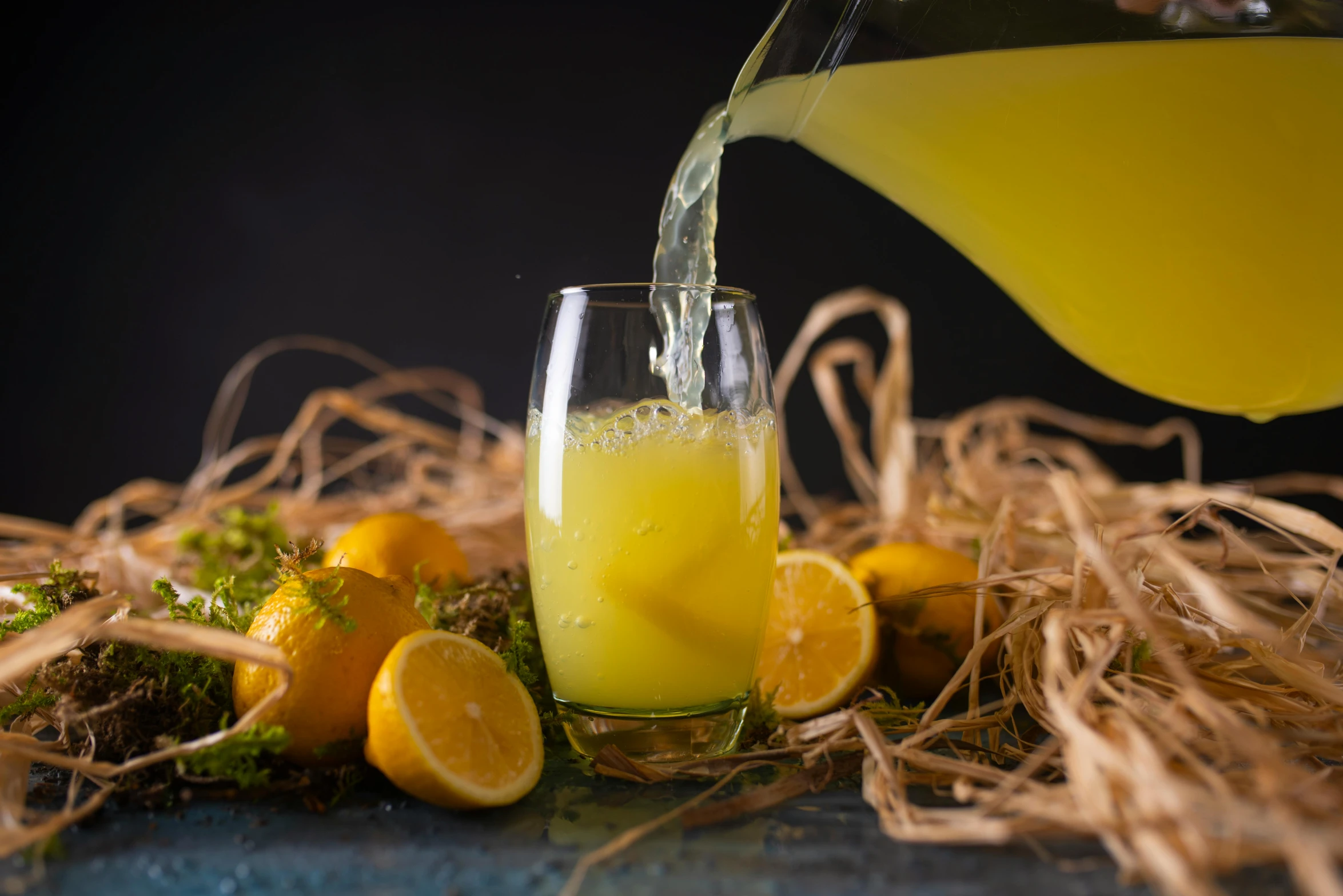 an image of orange juice being poured into glasses