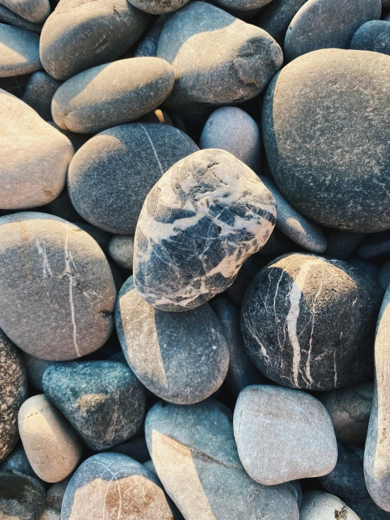 rocks are on top of one another in the sand