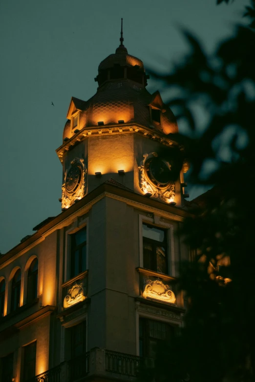 a clock tower is lit up at night