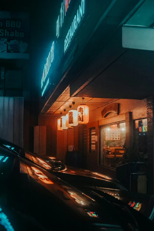 a picture of a building at night in the rain