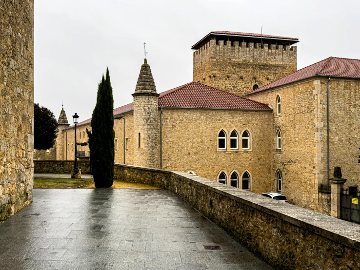 an old building with stone walls and towers