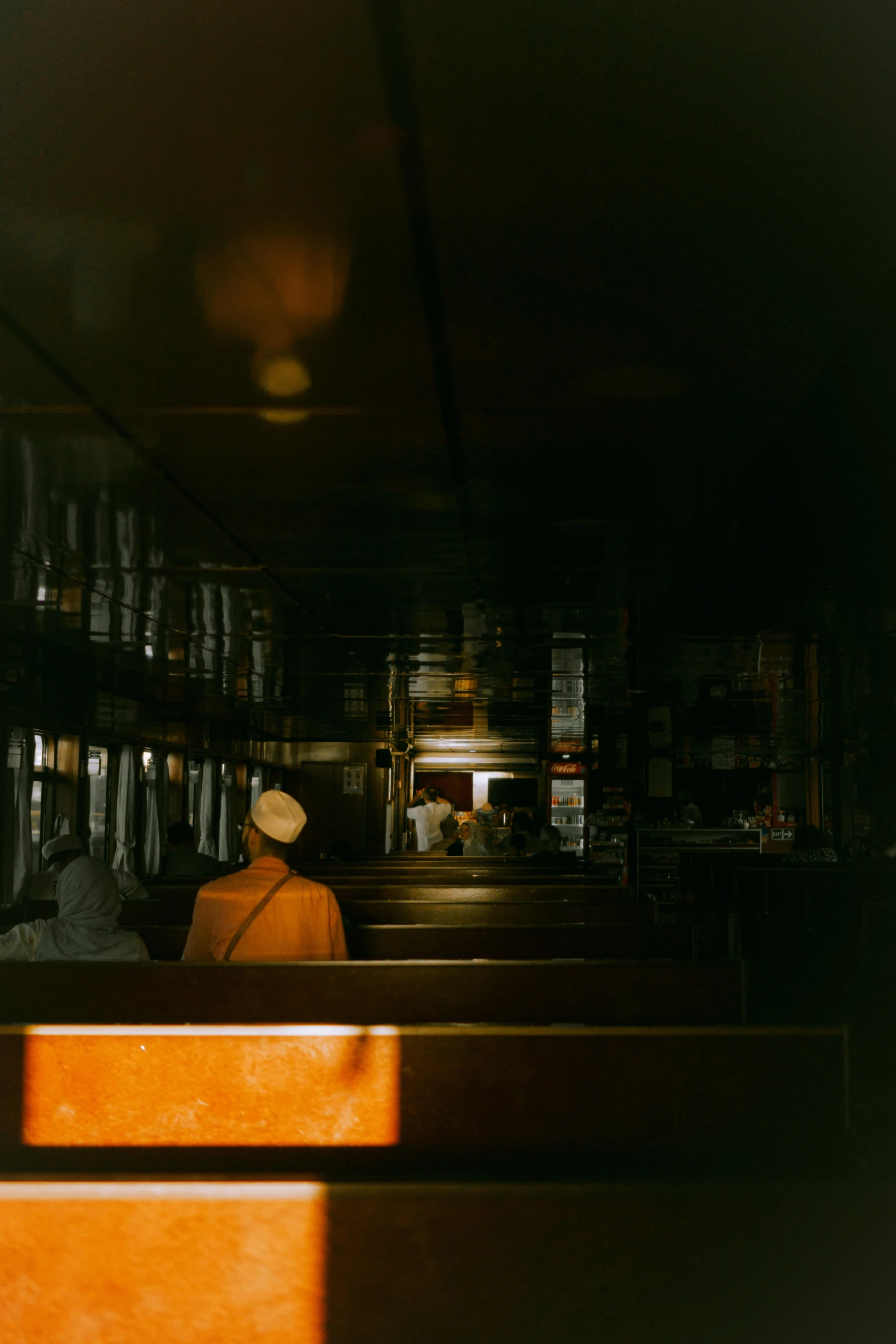 a person sitting in a bar at an outdoor restaurant