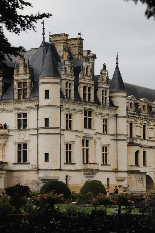 a large castle is shown in the middle of some greenery