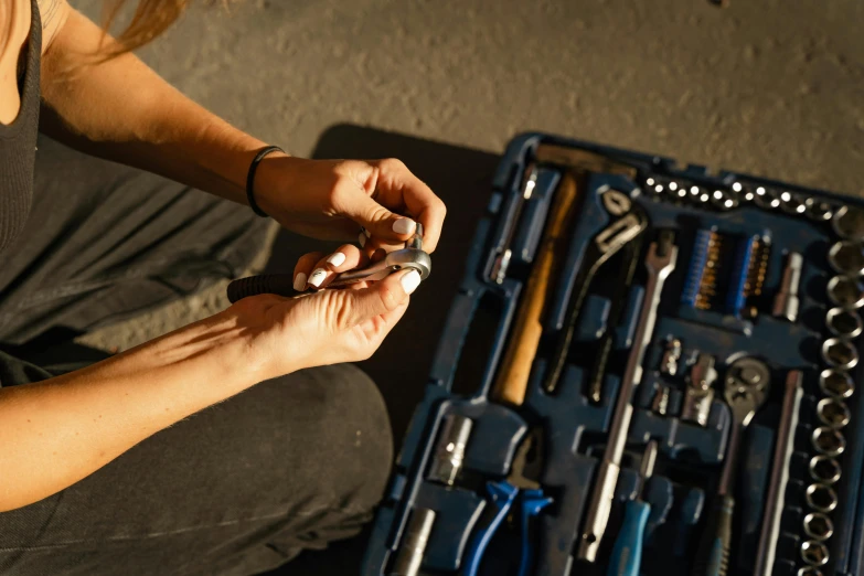 a person sitting in front of many tools