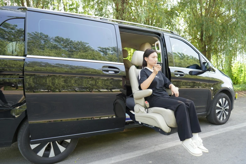 a woman sitting in the passenger seat of a van