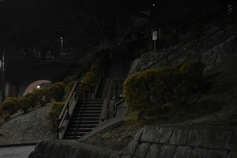 a dark building with stairs up to it