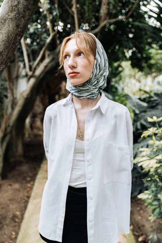 a woman wearing a scarf tied on her head