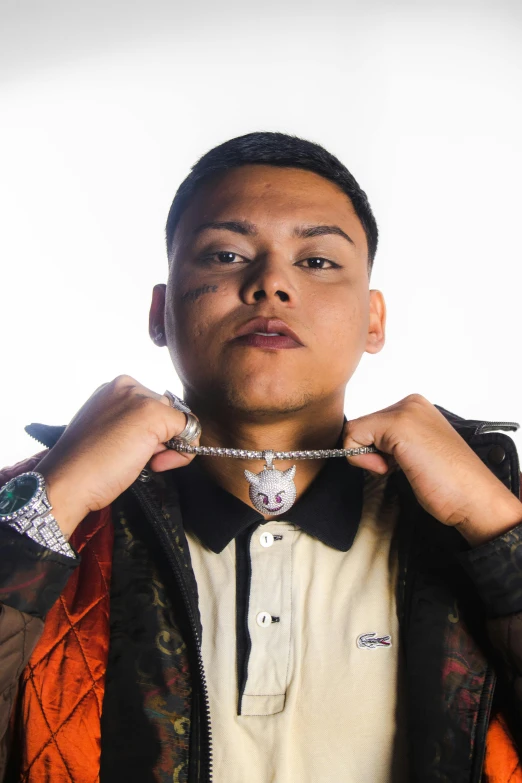 a man putting on his collar necklace