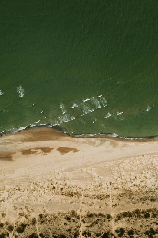 a beach with waves coming in onto it