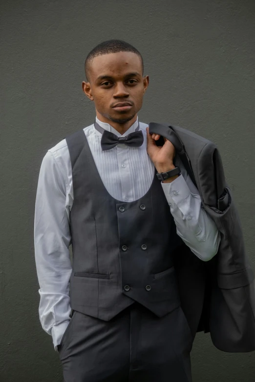 a man wearing a grey vest and a tie