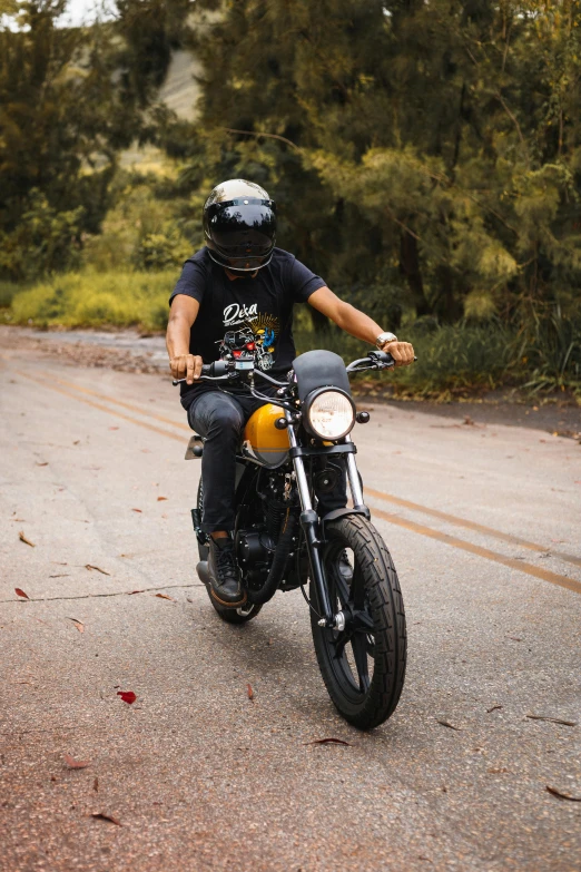 a man riding a motorcycle down a street