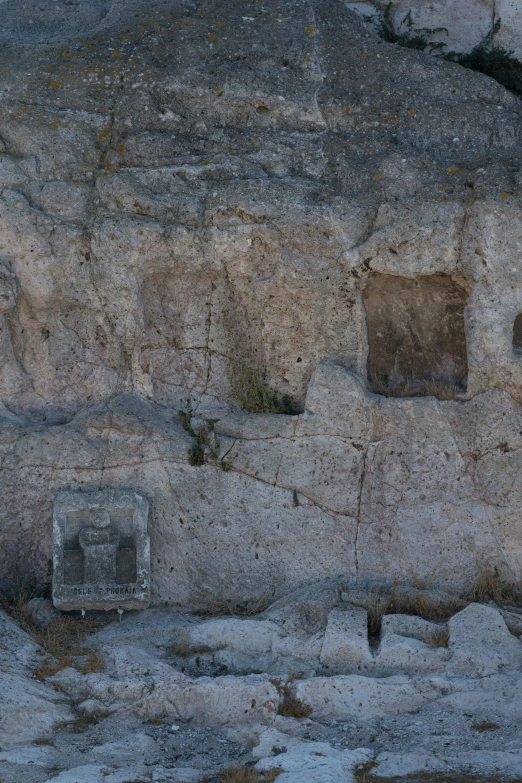 two windows are displayed in an ancient rock cliff