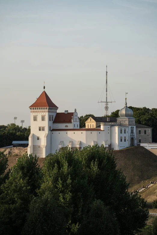 the building is built with large towers next to a river