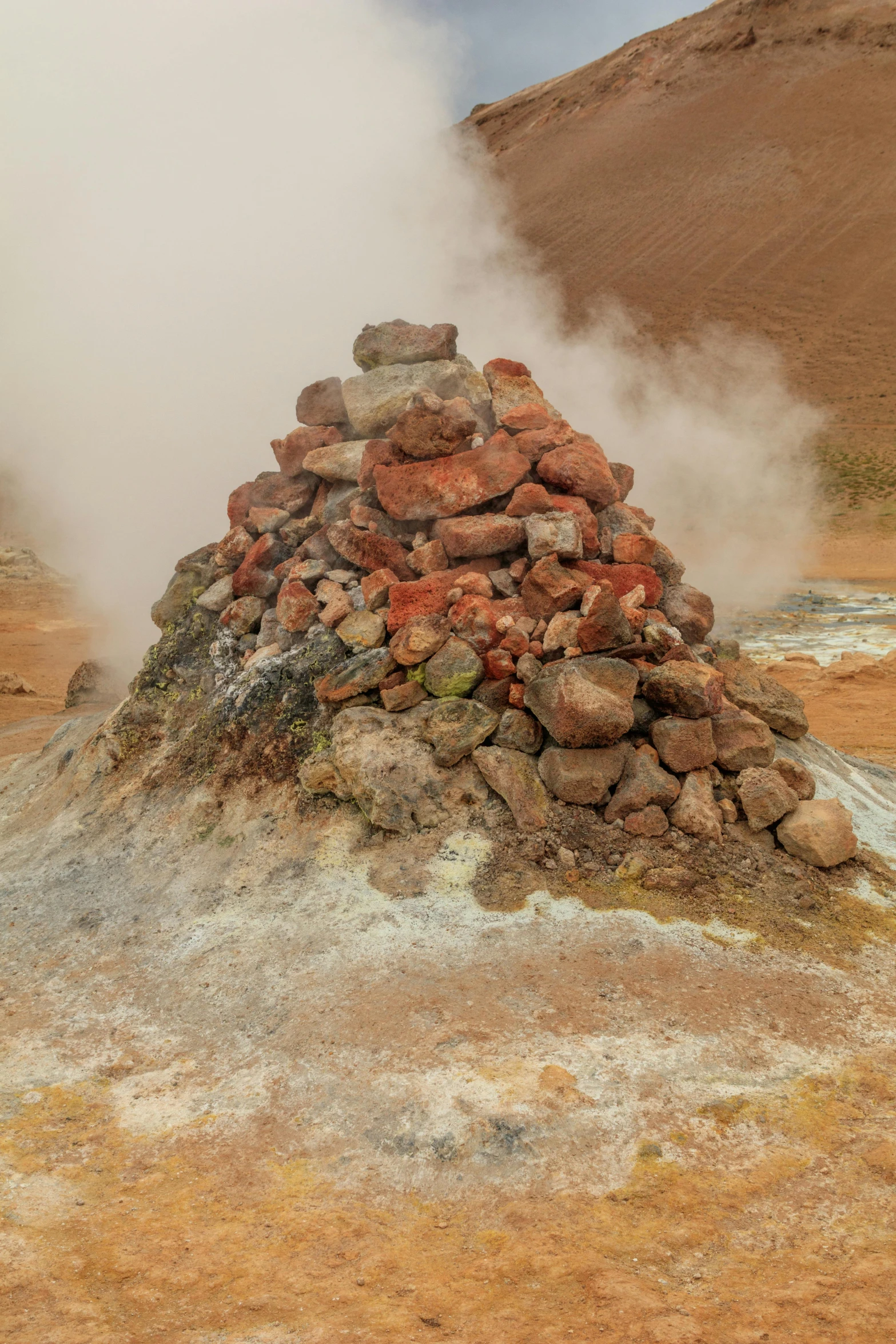 large rocks are stacked on top of one another in the desert