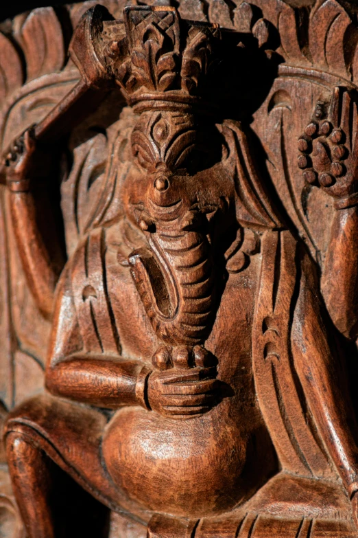 a carved wooden statue made from tree bark