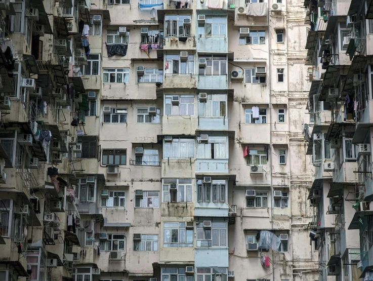 many windows on a high rise building, all lined up