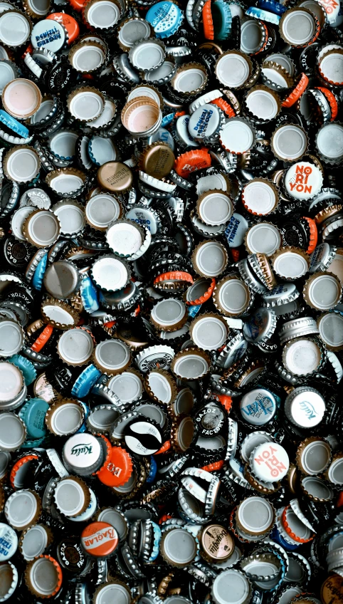 many small beer bottles together on the ground