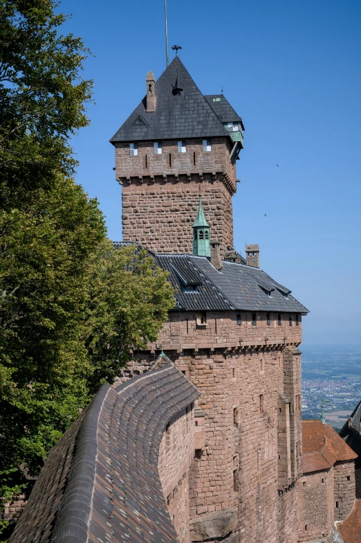 a brick tower with a clock on top of it