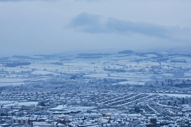 a scenic po of a snowy neighborhood, and its surroundings