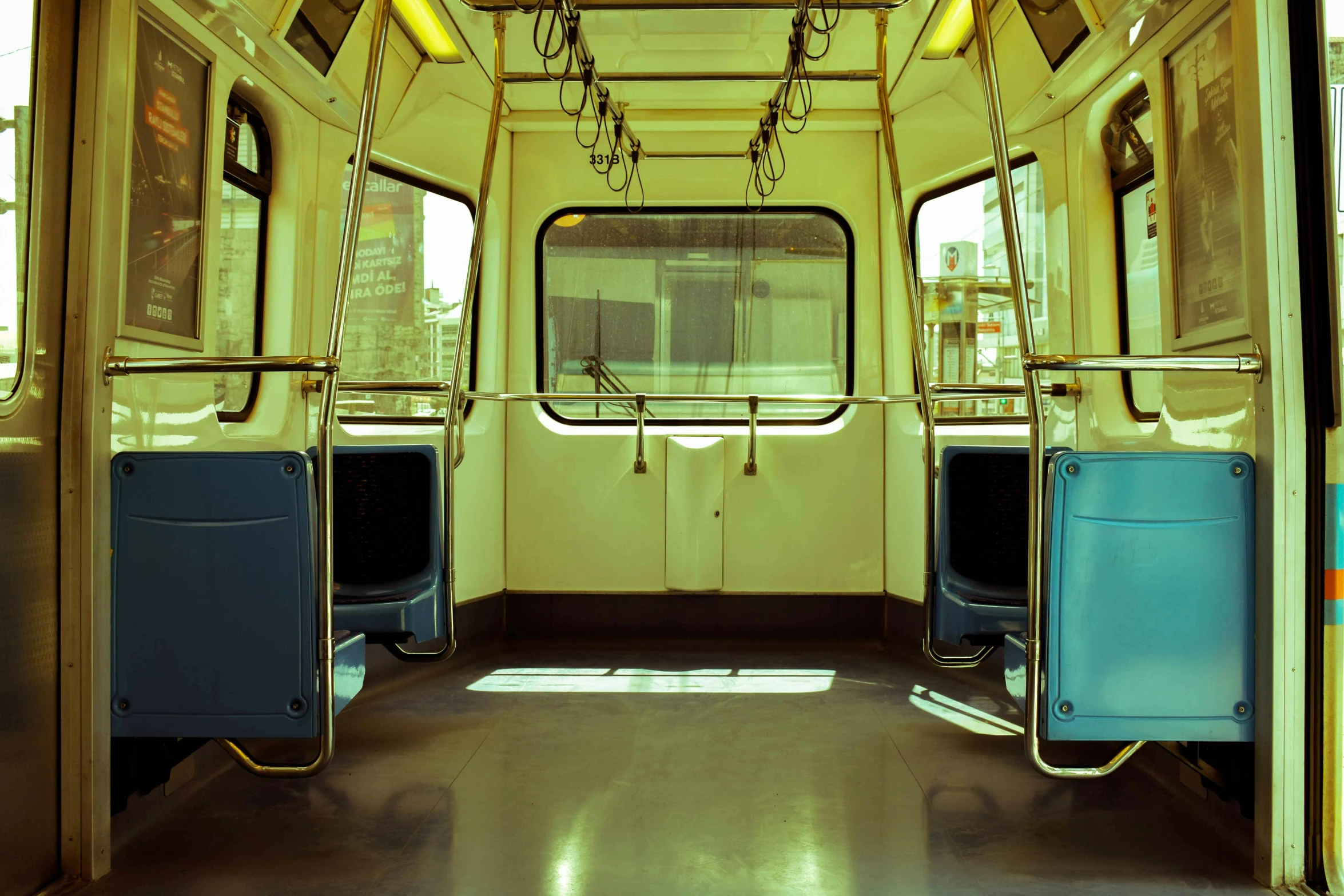 two blue and yellow seats facing opposite directions on a bus