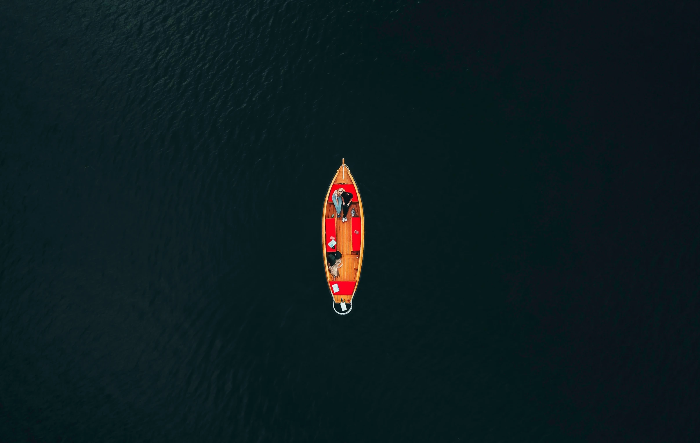 a boat riding on a large body of water