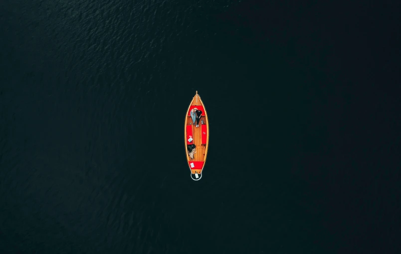 a boat riding on a large body of water