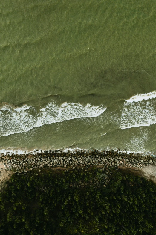 a view from above of the water and green beach