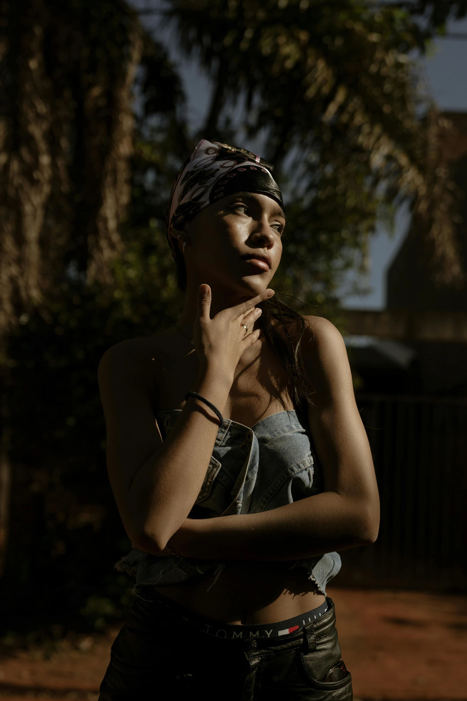 a woman with  is holding her hands to her face