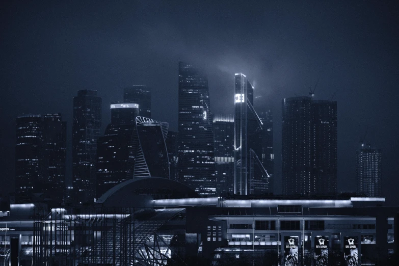 a city skyline with a very bright street light at night